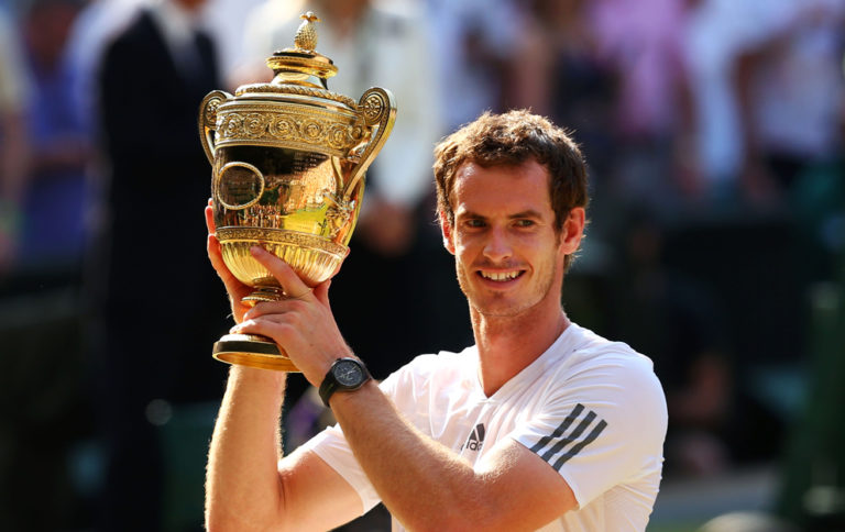 Andy Murray poses with the Wimbledon trophy