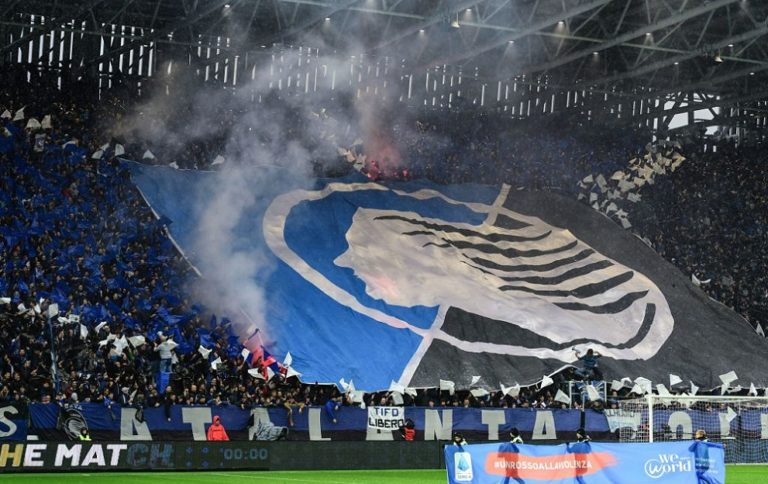 Fans unfurl a huge tifo as children hold a banner reading "A Red Card to Violence" and "WeWorld Onlus with children, with women, for their rights" against violence against children and women, prior to the Italian Serie A football match Atalanta Bergamo vs Juventus on November 23, 2019 at the Atleti Azzurri d