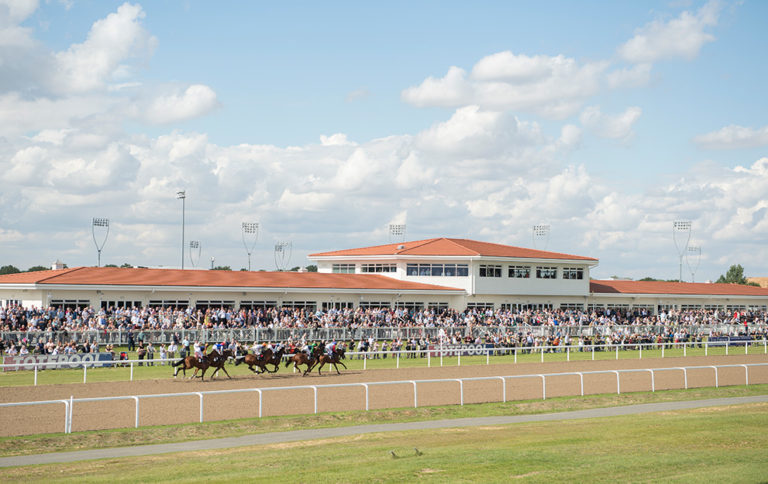 The runners in the 2m handicap pass the stands Chelmsford 31.8.17 Pic: Edward Whitaker