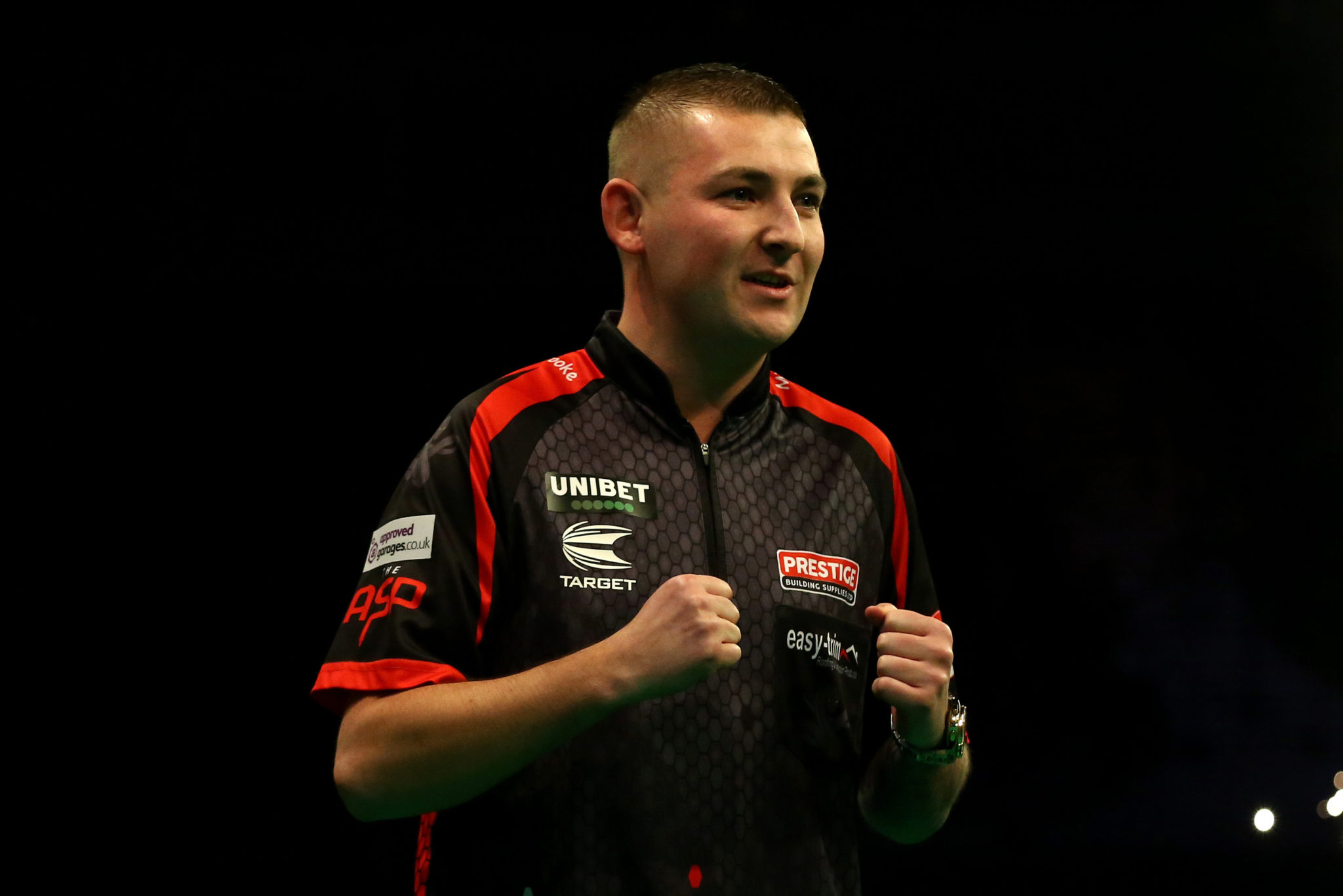 LIVERPOOL, ENGLAND - MARCH 12: Nathan Aspinall celebrates a draw in his match against Gary Anderson during Night Six of the Premier League Darts at the M&S Bank Arena on March 12, 2020 in Liverpool, England. (Photo by Lewis Storey/Getty Images)