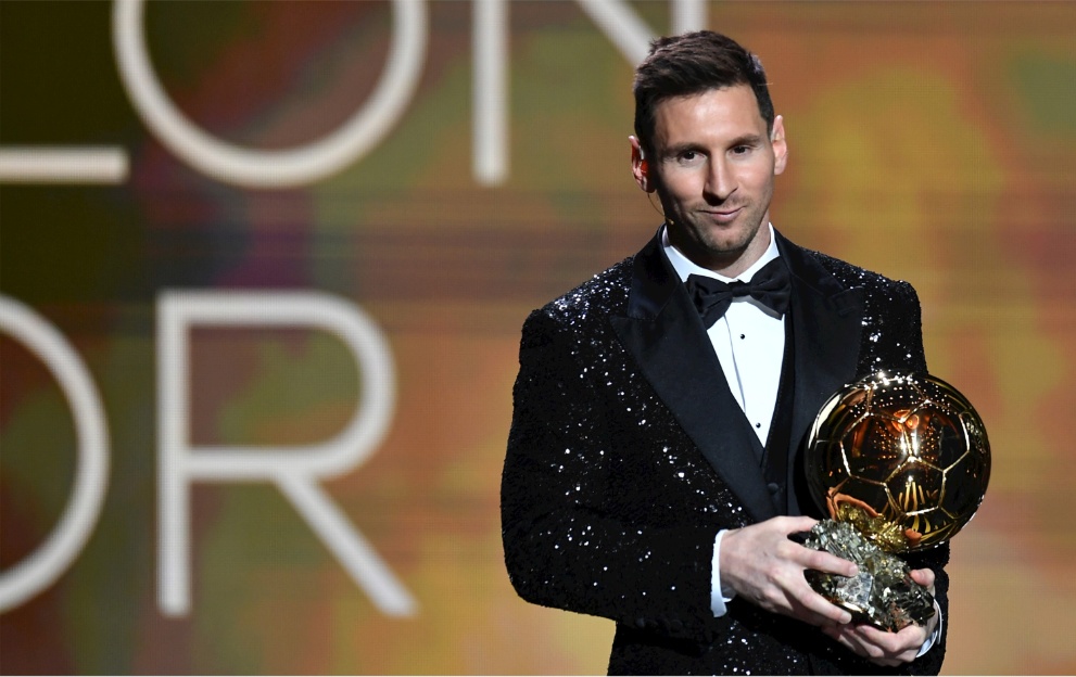 Lionel Messi with the Ballon d'Or trophy