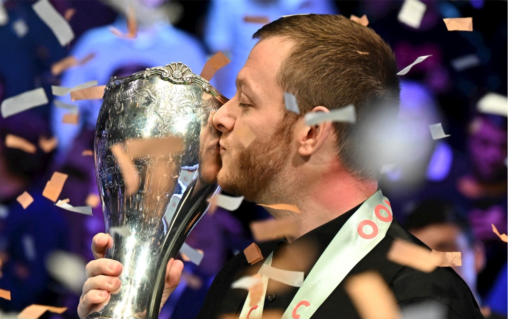 Mark Allen kisses the UK Championship trophy