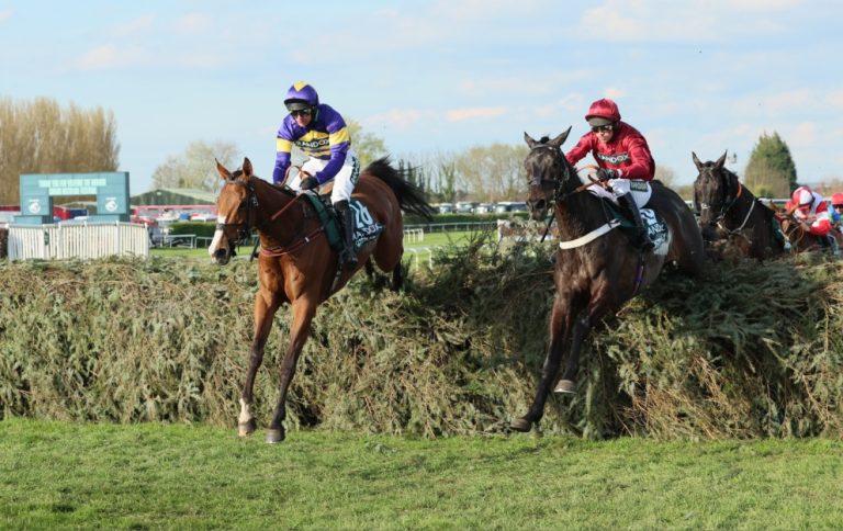 Corach Rambler jumping a fence at Aintree to win the Grand National