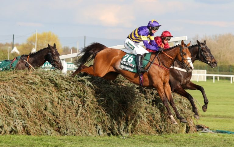 Corach Rambler jumping a fence in the Aintree Grand National