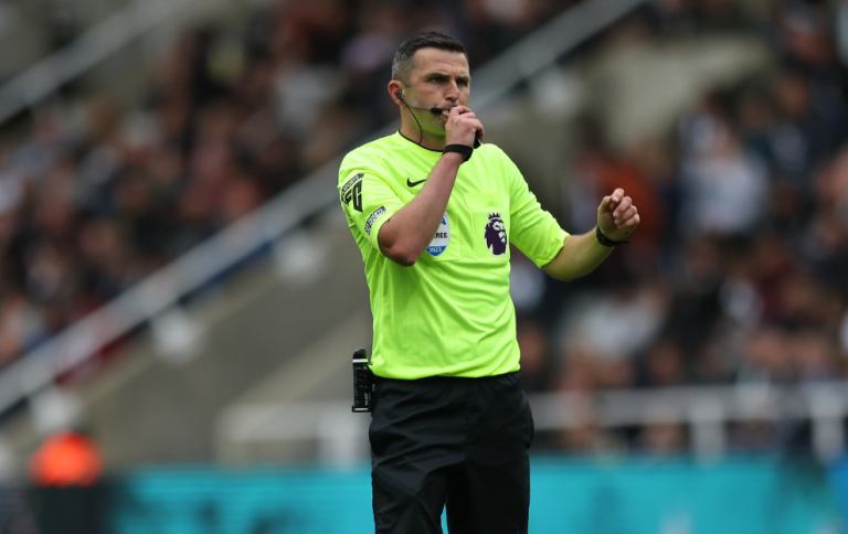 Premier League referee Michael Oliver blows a whistle