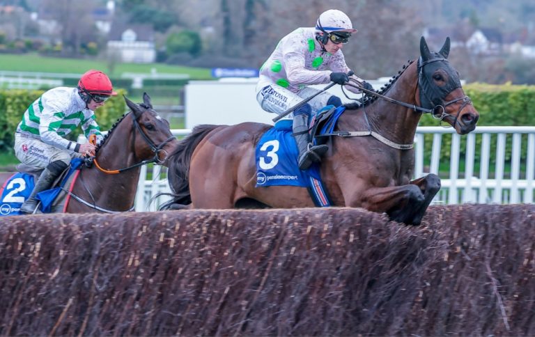 Gaelic Warrior jumping a fence in the Arkle Chase