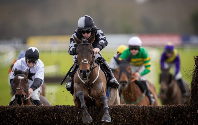 Midnight It Is jumping a fence at Fairyhouse