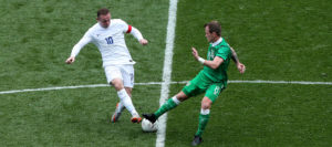 Wayne Rooney makes a tackle in midfield