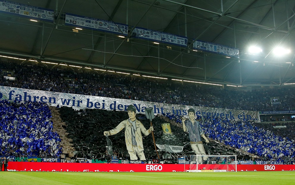 Soccer Football -DFB Cup - Schalke 04 vs Eintracht Frankfurt - Veltins-Arena, Gelsenkirchen, Germany - April 18, 2018 Schalke 04 fans display a banner before the match REUTERS/Leon Kuegeler DFB RULES PROHIBIT USE IN MMS SERVICES VIA HANDHELD DEVICES UNTIL TWO HOURS AFTER A MATCH AND ANY USAGE ON INTERNET OR ONLINE MEDIA SIMULATING VIDEO FOOTAGE DURING THE MATCH.