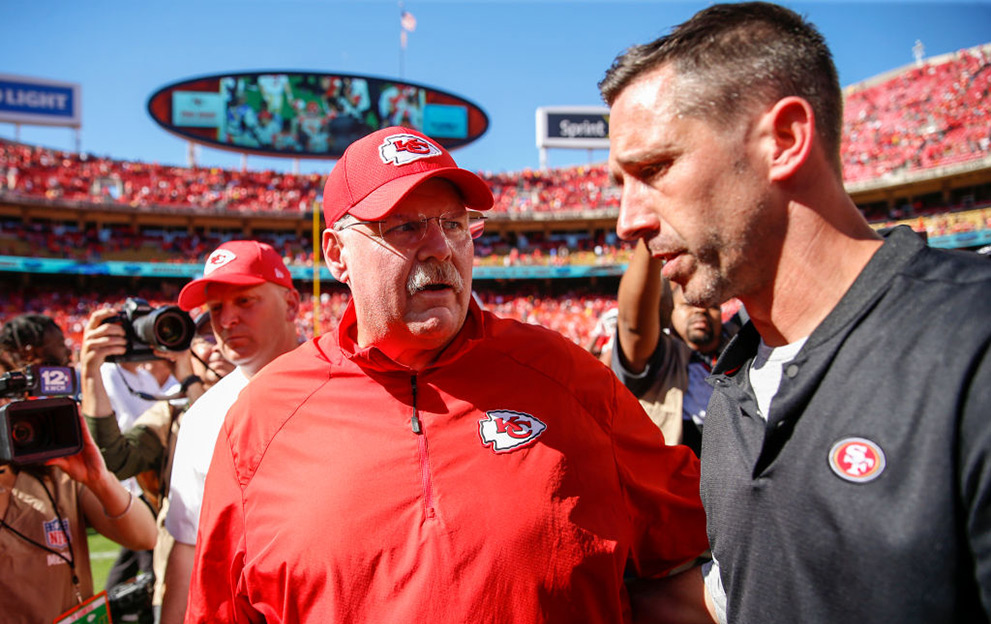KANSAS CITY, MO - SEPTEMBER 23: Head coach Andy Reid of the Kansas City Chiefs and head coach Kyle Shanahan of the San Francisco 49ers speak after the game at midfield at Arrowhead Stadium on September 23rd, 2018 in Kansas City, Missouri. (Photo by David Eulitt/Getty Images)
