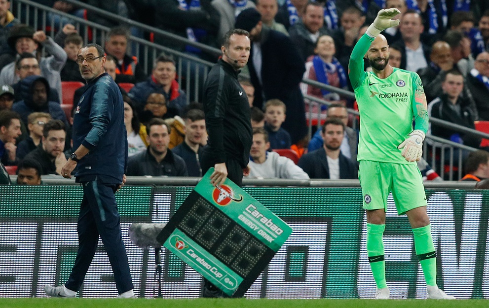 Chelsea's Italian head coach Maurizio Sarri (L) reacts after Chelsea's Spanish goalkeeper Kepa Arrizabalaga remains on the pitch after an attempt to substitute him for Chelsea's Argentinian goalkeeper Willy Caballero (R) during the English League Cup final football match between Manchester City and Chelsea at Wembley stadium in north London on February 24, 2019. (Photo by Adrian DENNIS / AFP) / RESTRICTED TO EDITORIAL USE. No use with unauthorized audio, video, data, fixture lists, club/league logos or 'live' services. Online in-match use limited to 75 images, no video emulation. No use in betting, games or single club/league/player publications. / (Photo credit should read ADRIAN DENNIS/AFP/Getty Images)