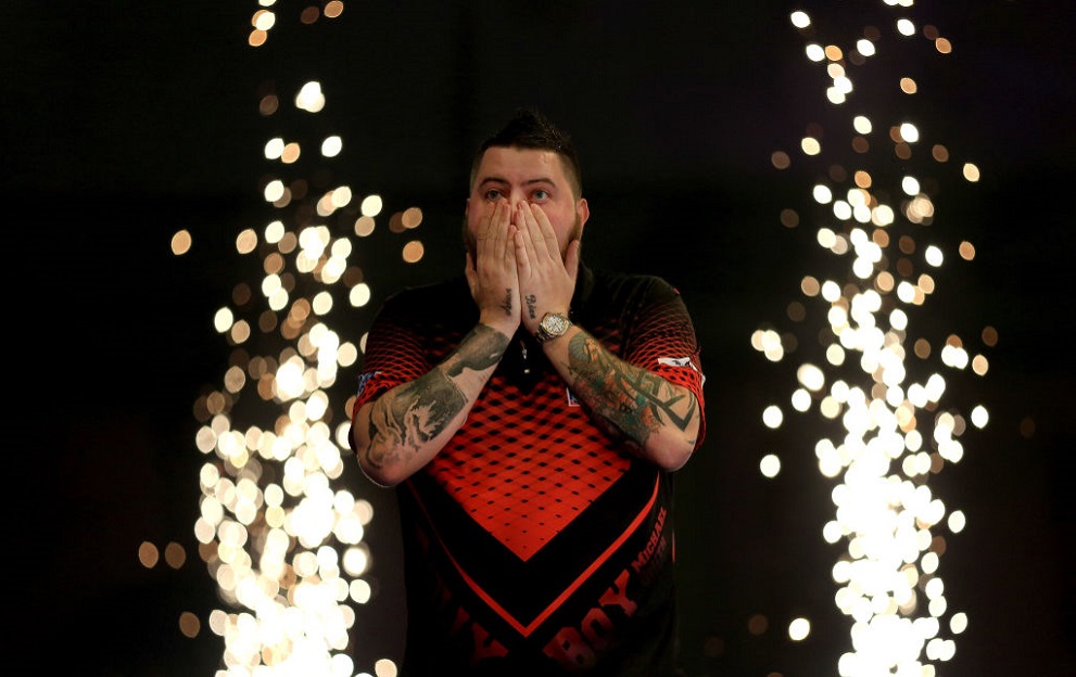 LONDON, ENGLAND - DECEMBER 30: Michael Smith of England celebrates victory over Nathan Aspinall of England after the 2019 William Hill World Darts Championship Semi-Final match between Nathan Aspinall and Michael Smith at Alexandra Palace on December 30, 2018 in London, United Kingdom. (Photo by James Chance/Getty Images)