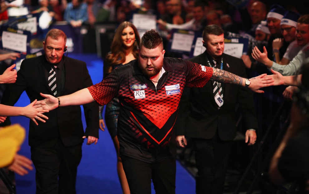 LONDON, ENGLAND - DECEMBER 23: Michael Smith of England walks onto the stage prior to the secod round match against Rob Cross of England on day ten of the 2018 William Hill PDC World Darts Championships at Alexandra Palace on December 23, 2017 in London, England. (Photo by Naomi Baker/Getty Images)