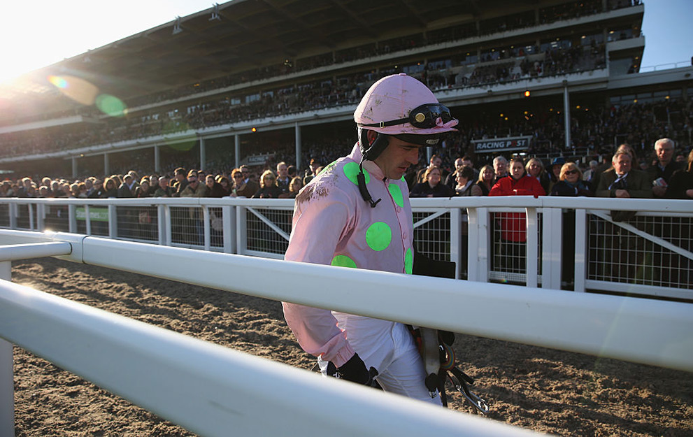 CHELTENHAM, ENGLAND - MARCH 10 : Ruby Walsh walks back along the main grandstand after falling at the last riding Annie Power during the Olbg Mares' Hurdle Race on day one at Cheltenham Racecourse on March 10, 2015 in Cheltenham, England. (Photo by Michael Steele/Getty Images)