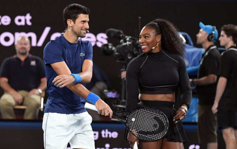 Serena Williams of the US and Novak Djokovic of Serbia share a lighter moment as they and other top players play in the Rally for Relief charity tennis match in support of the victims of the Australian bushfires, in Melbourne of January 15, 2020, ahead of the Australian Open tennis tournament. (Photo by WILLIAM WEST / AFP) / -- IMAGE RESTRICTED TO EDITORIAL USE - STRICTLY NO COMMERCIAL USE -- (Photo by WILLIAM WEST/AFP via Getty Images)