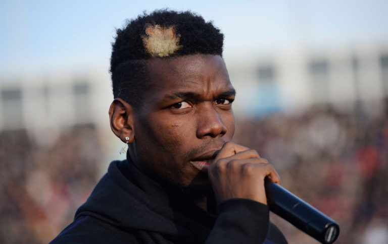 Manchester United and France midfielder Paul Pogba speaks prior to a gala football match between All Star France and Guinea at the Vallee du Cher Stadium in Tours, central France, on December 29, 2019, as part of the 