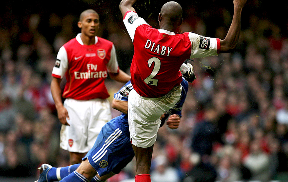 Cardiff, UNITED KINGDOM: Arsenal's French midfielder Abou Diaby kicks Chelsea's english defender John Terry in the head during the English League Cup Final football match against Chelsea at The Millennium Stadium, Cardiff, Wales, 25 February 2007. AFP PHOTO / PAUL ELLIS Mobile and website use of domestic English football pictures subject to a subscription of a license with Football Association Premier League (FAPL) tel: +44 207 2981656. For newspapers where the football content of the printed and electronic versions are identical, no license is necessary. (Photo credit should read PAUL ELLIS/AFP via Getty Images)