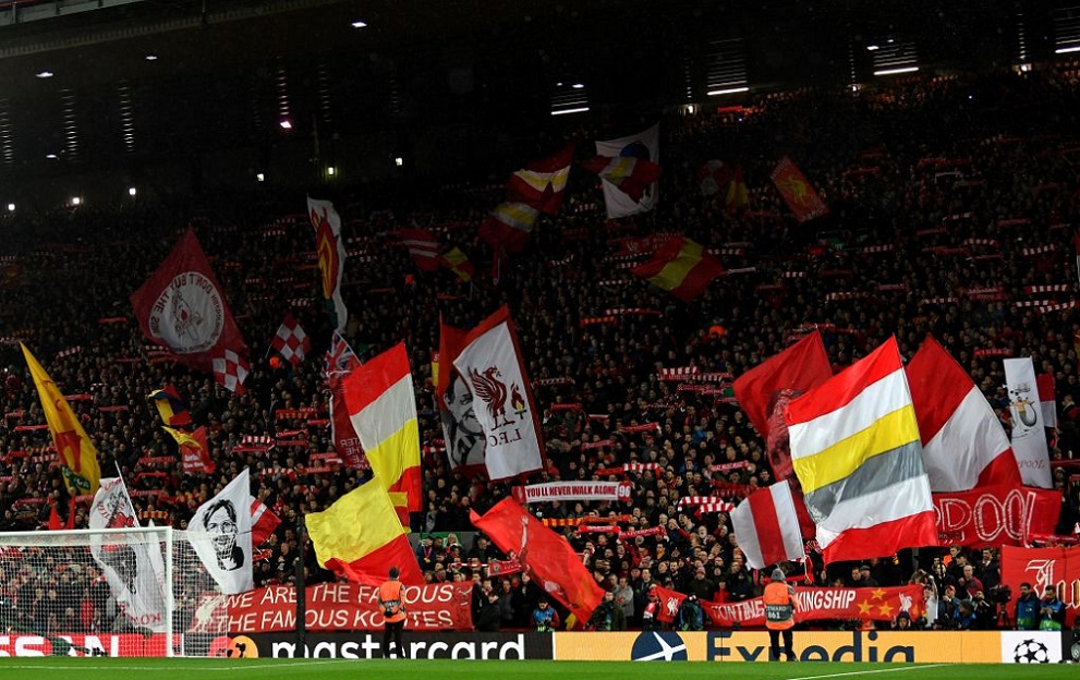 Liverpool supporters wave flags before the UEFA Champions league Round of 16 second leg football match between Liverpool and Atletico Madrid at Anfield in Liverpool, north west England on March 11, 2020. (Photo by Paul ELLIS / AFP) (Photo by PAUL ELLIS/AFP via Getty Images)