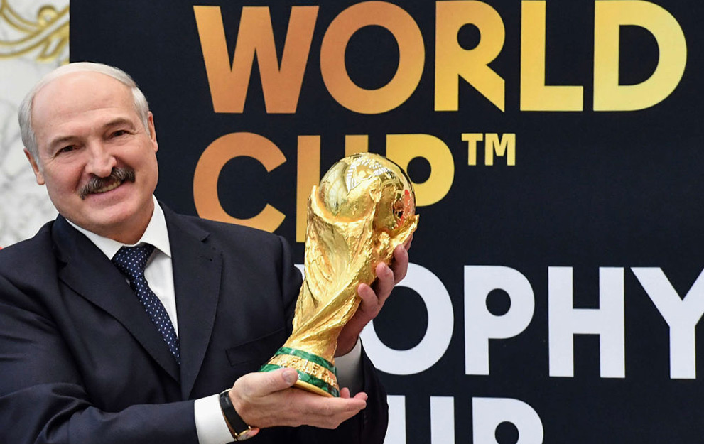 Belarus President Alexander Lukashenko holds the FIFA World Cup trophy during a ceremony in Minsk on February 13, 2018. The FIFA World Cup Trophy Tour is heading to 50 countries across six continents before returning to the host country in May, ahead of the 2018 FIFA World Cup in Russia. / AFP PHOTO / BELTA / Andrei Stasevich (Photo credit should read ANDREI STASEVICH/AFP via Getty Images)