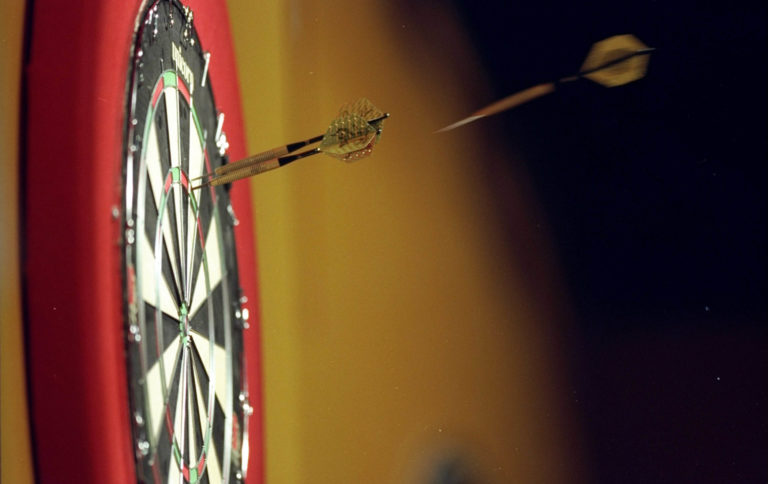 Jan 1999: A general view of the third dart about to strike the board during the PDC World Darts Championships in Purfleet in Essex, England. Mandatory Credit: John Gichigi /Allsport