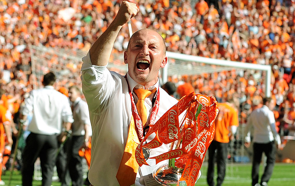 Blackpool's manager Ian Holloway celebrates with the trophy after his team beat Cardiff City during the 2010 Championship play-off final football match at Wembley Stadium in London on May 22, 2010. Blackpool won the game 3-2 to win promotion to the Premier League next season. AFP PHOTO / Adrian Dennis (Photo credit should read ADRIAN DENNIS/AFP via Getty Images)
