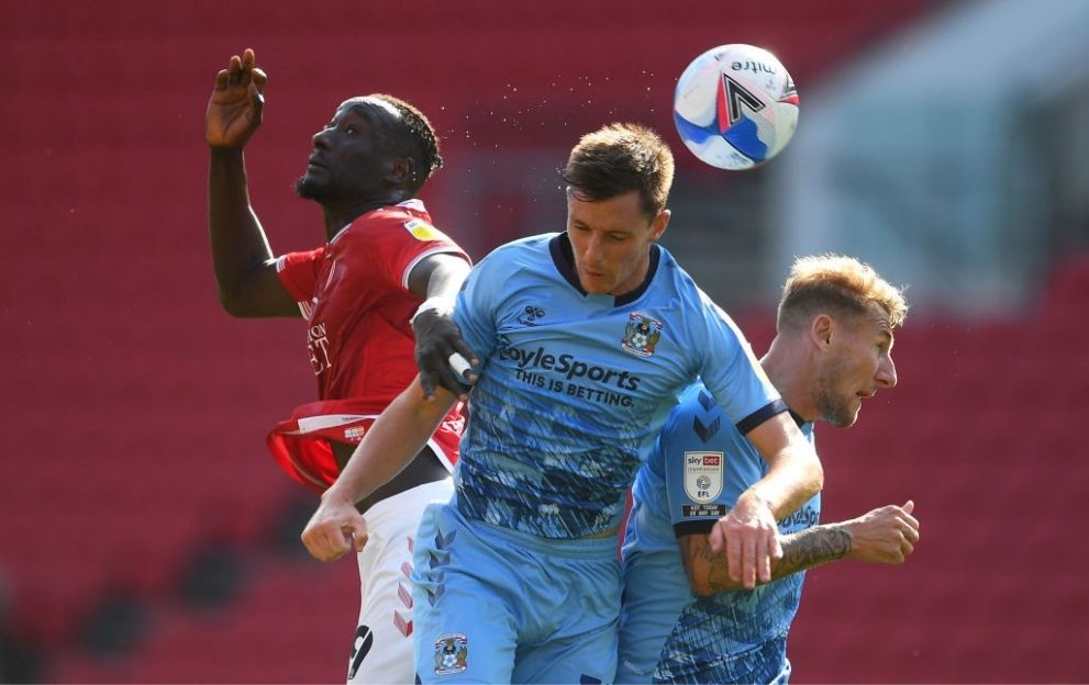Dominic Hyam of Coventry City(C) and Kyle McFadzean of Coventry City challenges for the high ball with Famara Diedhiou of Bristol City(L) during the Sky Bet Championship match between Bristol City and Coventry City at Ashton Gate on September 12, 2020