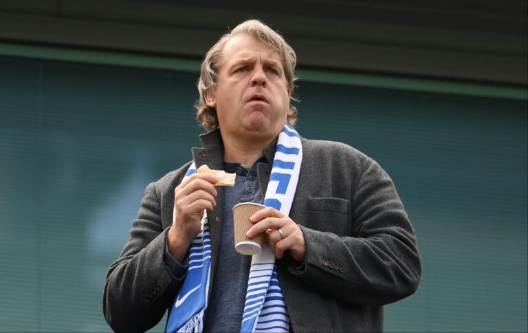 Chelsea owner Todd Boehly holding a coffee