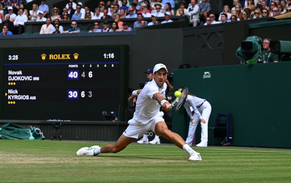 Novak Djokovic hits a tennis ball at Wimbledon