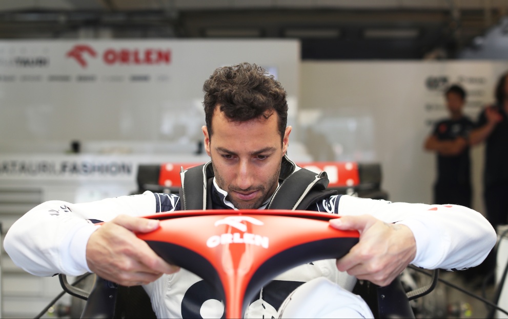 Daniel Ricciardo gets in his AlphaTauri car